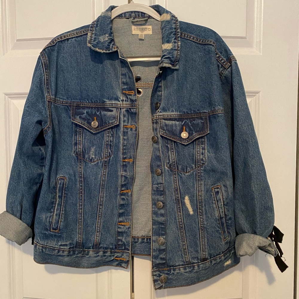 oversized jean jacket with detailing on the back